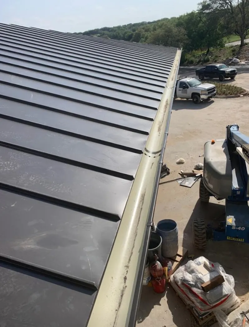 Standing seam panel and gutter detail on a metal roofing jobsite in Harrisburg